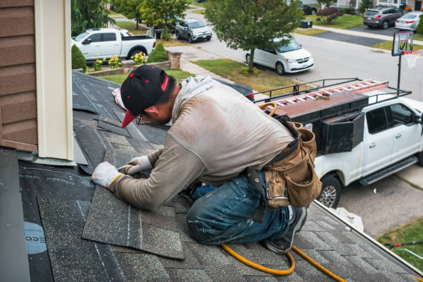 Professional Roofing technician working in Nassau, NY
